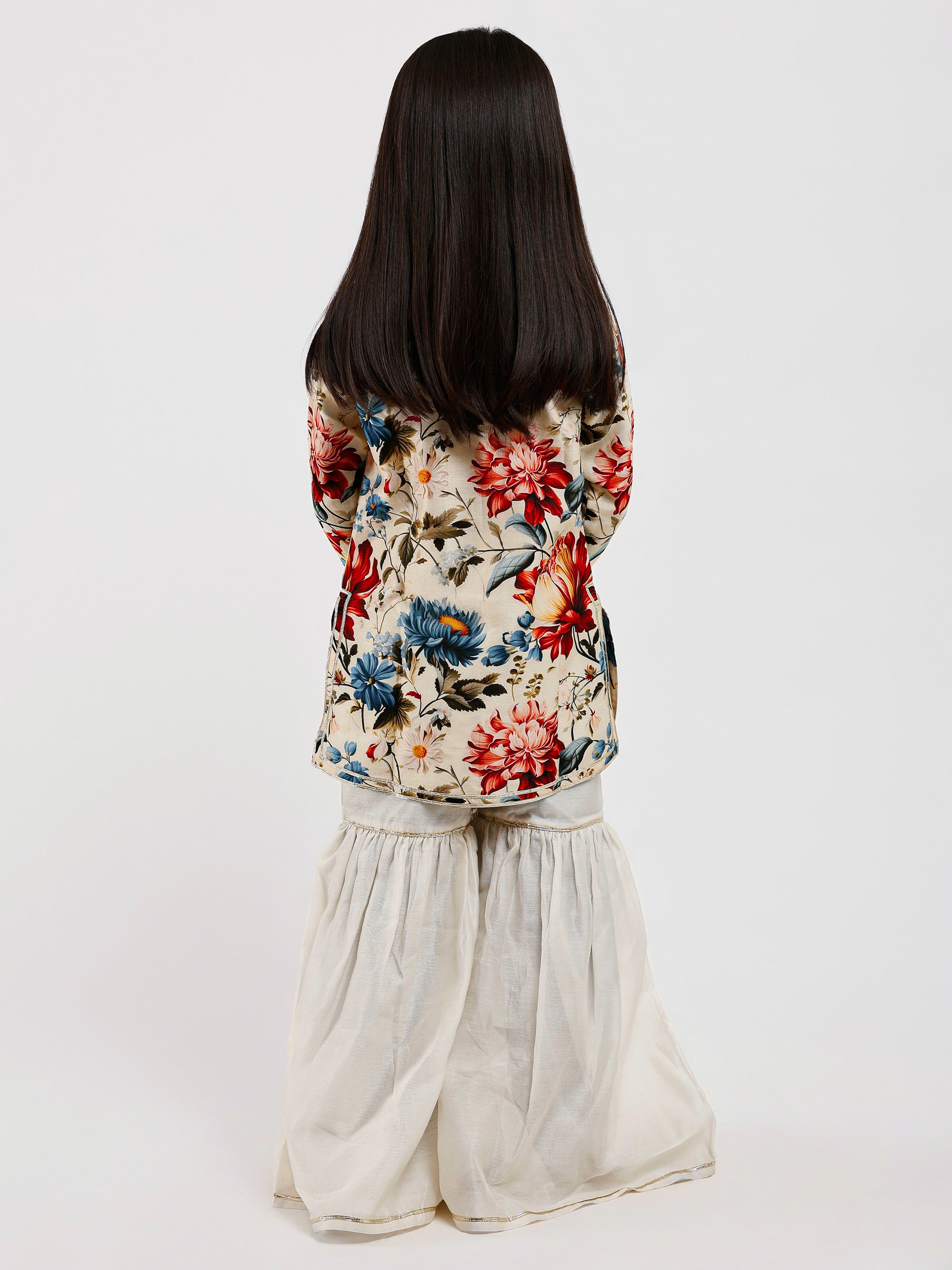 Model showing back side of Ivory Floral Sharara Set